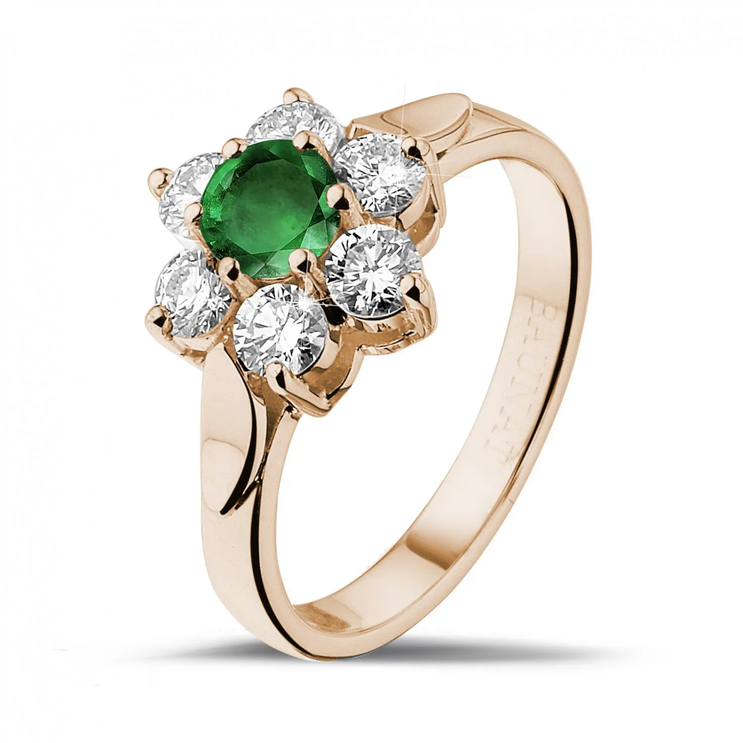 Anillo flor en oro rojo con esmeralda redonda y diamantes en los lados 