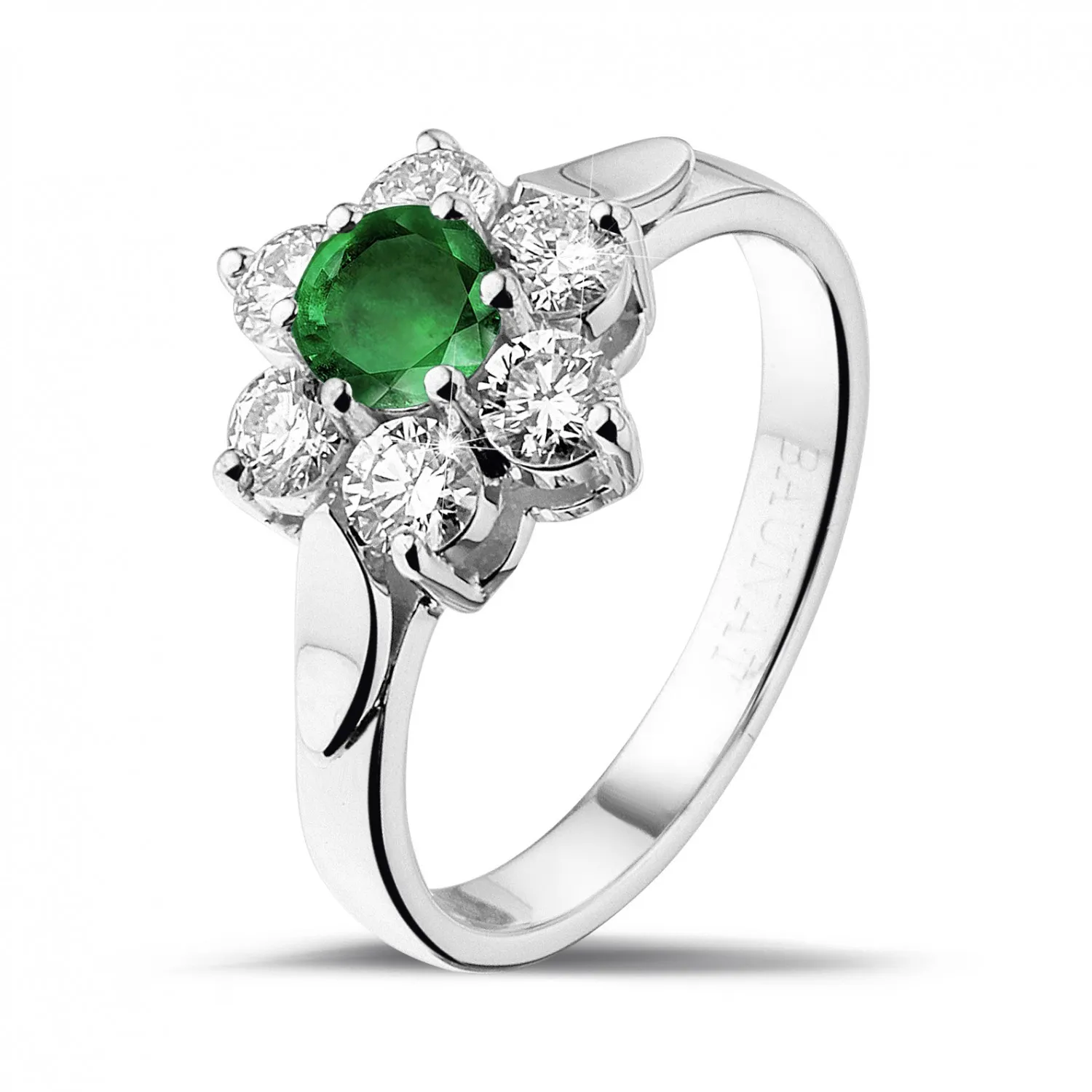 Anillo flor en Platino con esmeralda redonda y diamantes en los lados 