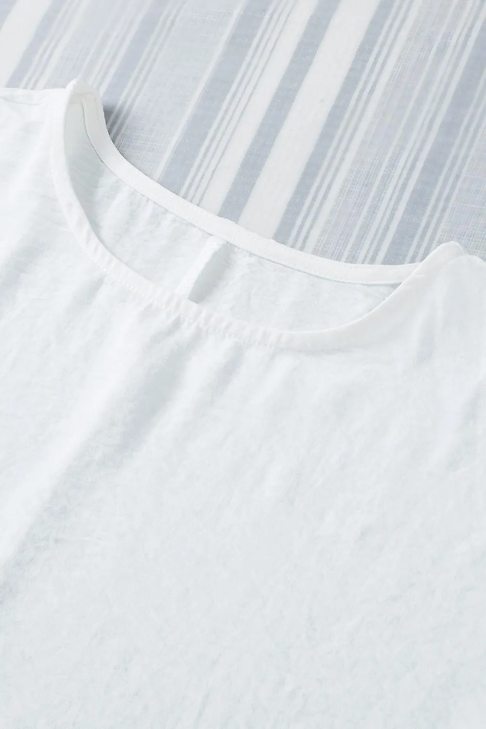 Camiseta de muñeca blanca para mujer