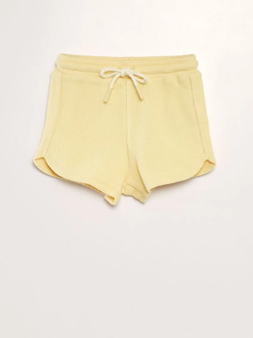 SHORT LISO ESTILO TEJIDO DE RIZO  AMARILLO